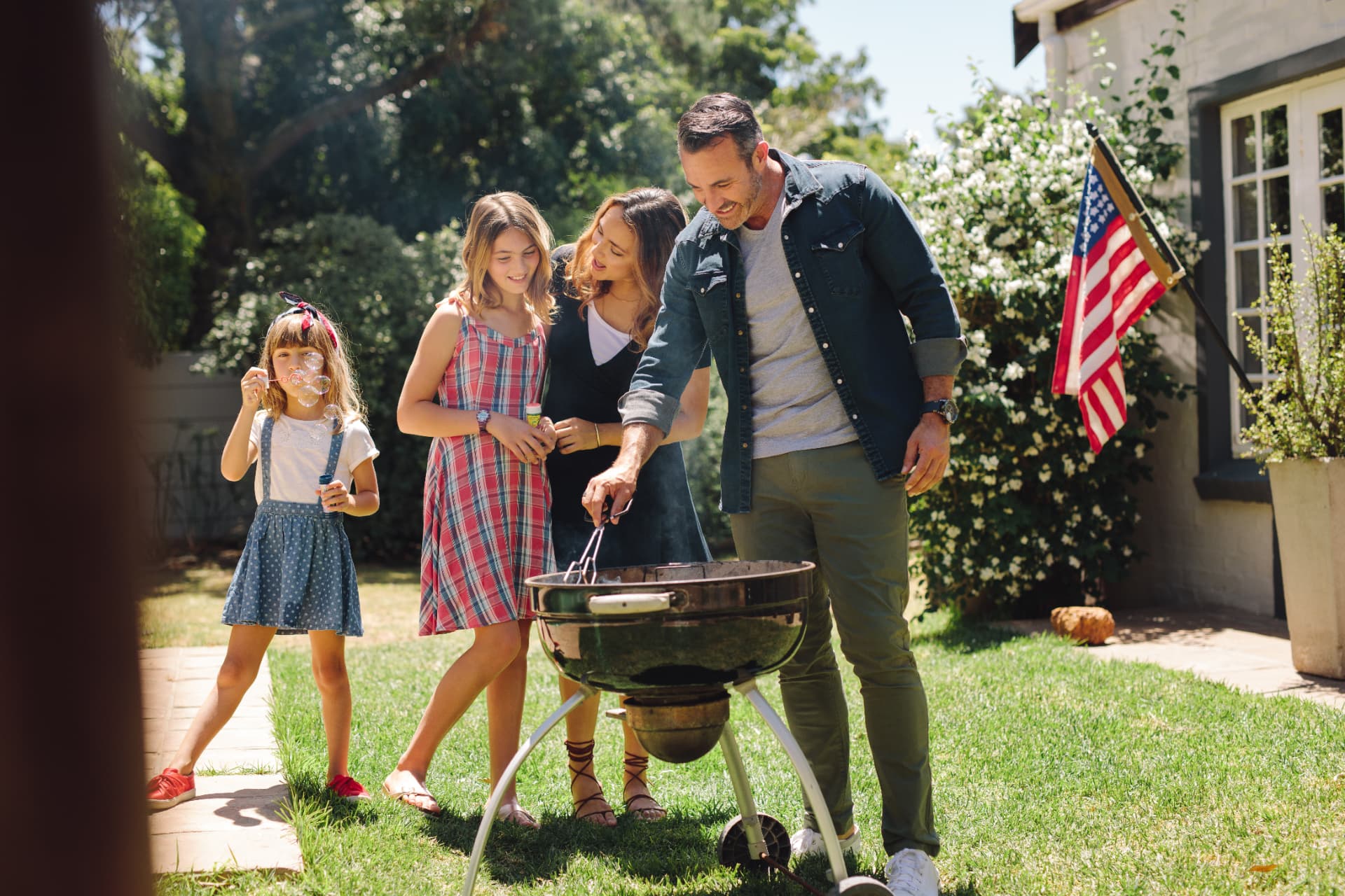 Happy family grilling outdoors in Napa Valley, representing lifestyle wellness and preventive care